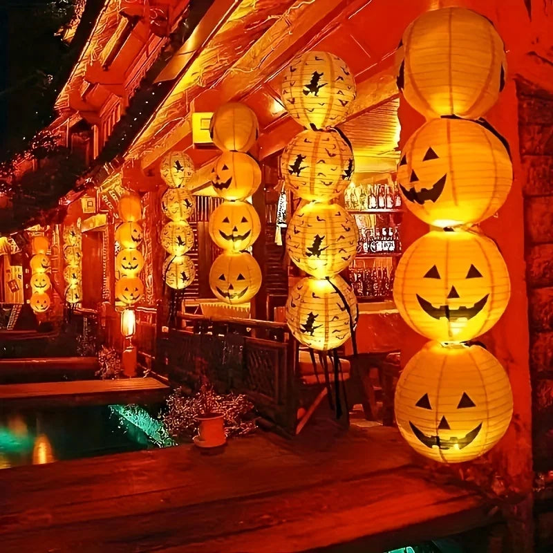 Two 8 inch paper Halloween pumpkin jack o lantern lanterns