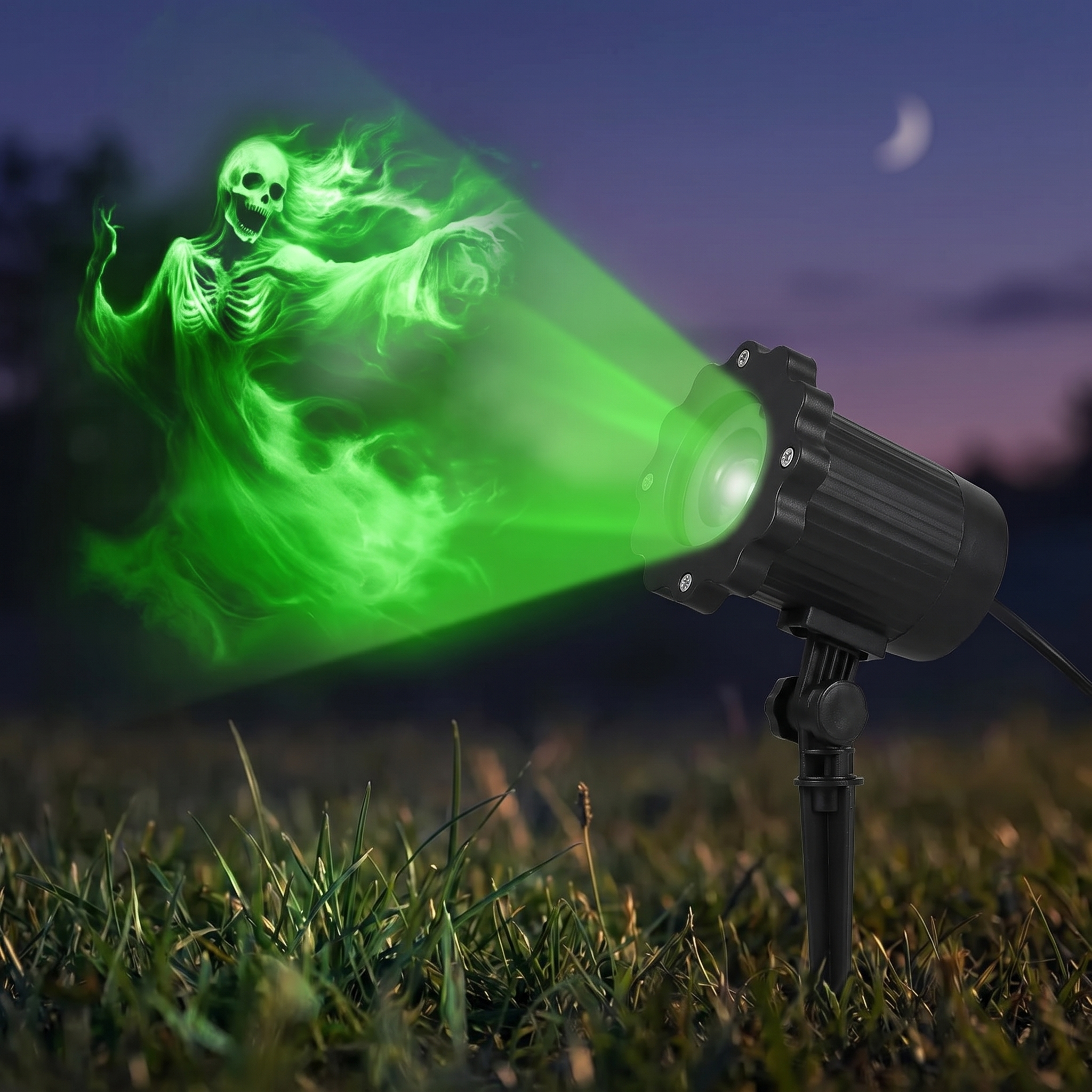 Close-up of the compact ghost projector unit on a stake in grass