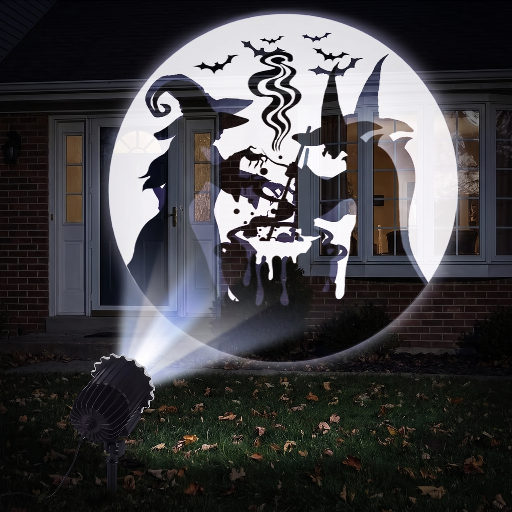 Halloween patterns projected onto a front window and door at night
