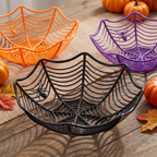 Spider web bowls holding snacks at a Halloween buffet