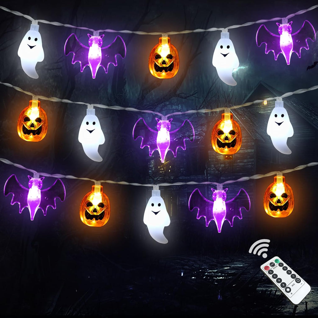 Pumpkin, bat and ghost style Halloween string lights laid out