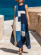 Blue geometric colorblock sleeveless maxi dress on a seaside promenade