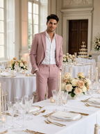 Man wearing a mauve slim-fit two-piece suit at a wedding reception venue
