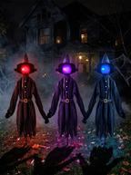 Glowing witches trio on a lawn at night