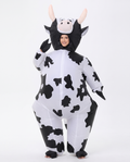 Adult wearing an inflatable black and white cow costume, front view