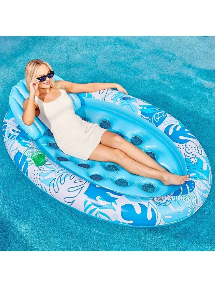 Pool lounger in use beside a swimming pool