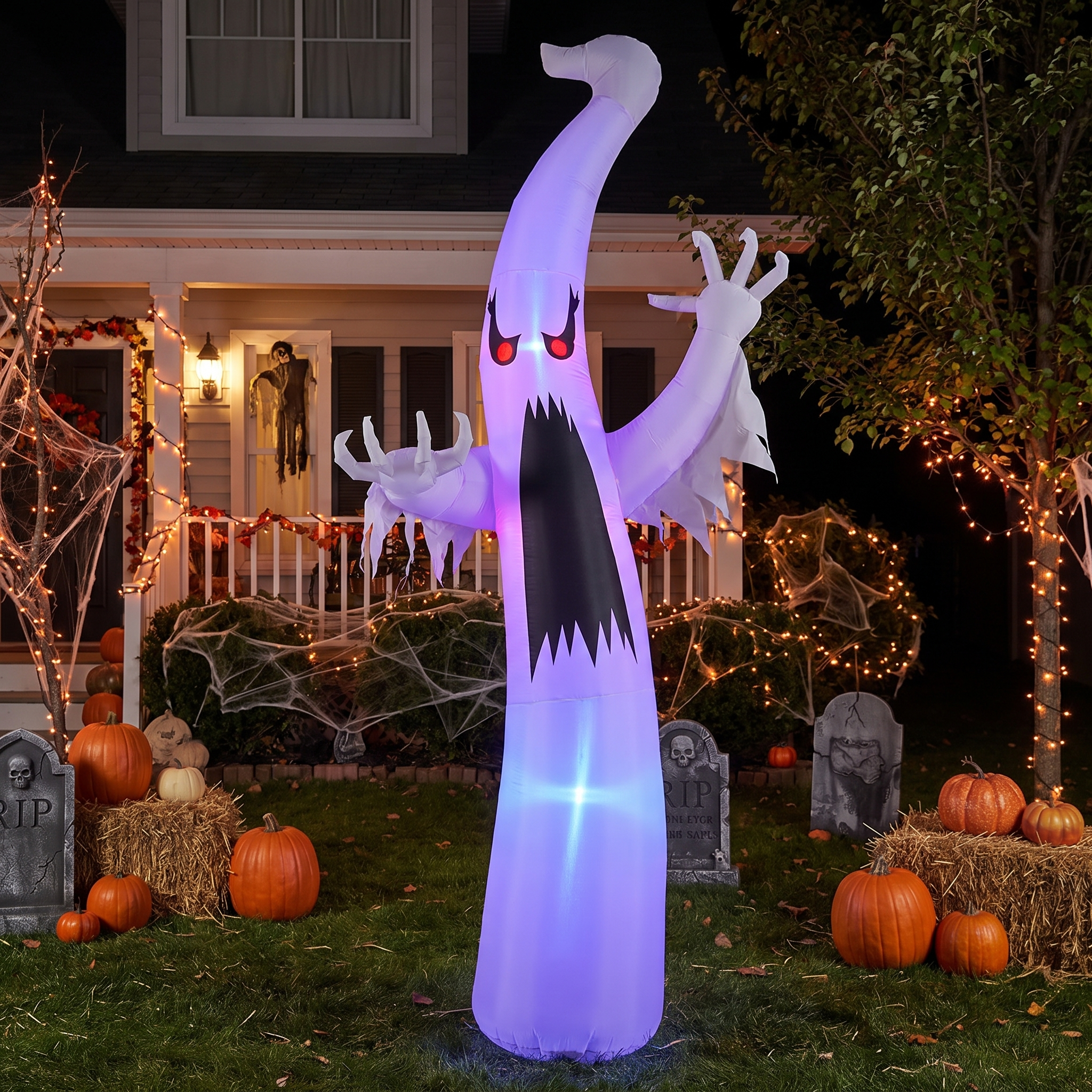 Red-eye ghost inflatable shown full size in a Halloween yard display