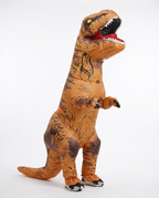 Adult wearing a brown inflatable T-Rex dinosaur costume, front view
