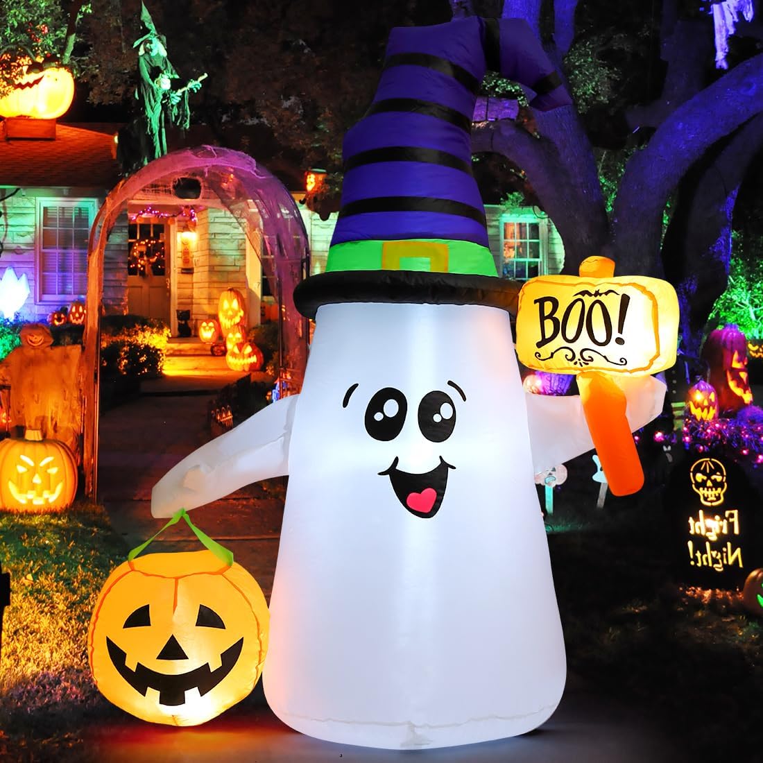 Inflatable wizard ghost holding a glowing jack-o-lantern