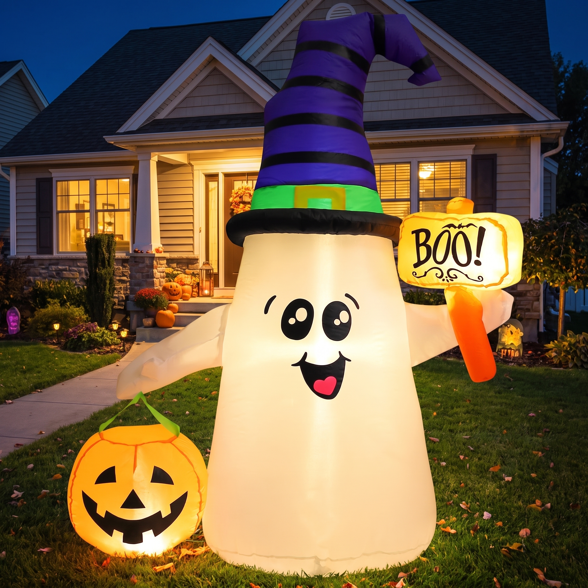 Inflatable wizard ghost lit up on a front lawn at night
