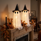 Light-up ghosts on a styled mantel