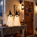 Light-up ghosts on an entryway table at night
