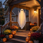 Light-up swing ghost hanging on a decorated Halloween front porch