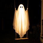 Hanging swing ghost glowing in a yard at night