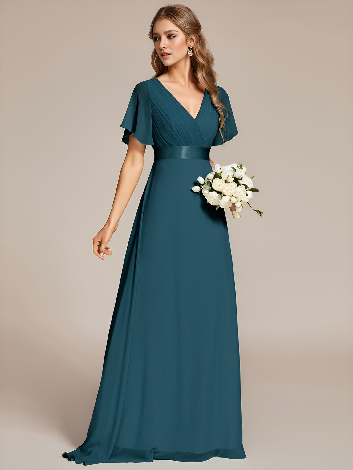Long chiffon bridesmaid dress with empire waist and flutter sleeves in teal