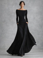 Long sleeve draped maxi dress in black, front view