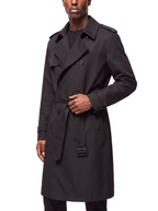 Black trench coat three quarter view showing tailored fit