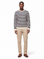 Navy and cream striped crew neck sweater, full-length view on model