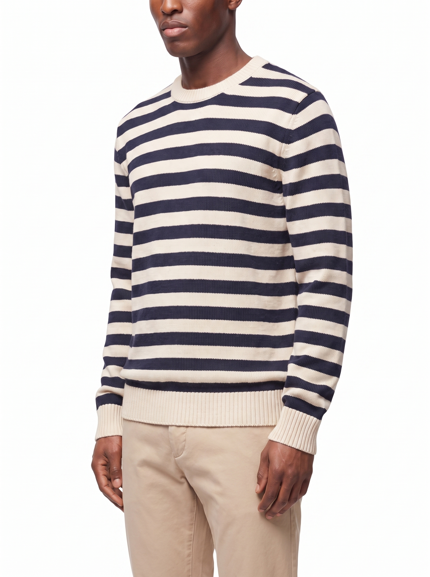 Three-quarter view showing the regular fit of the striped sweater