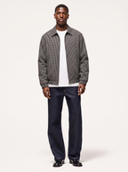 Black and white micro plaid harrington jacket, front view on model