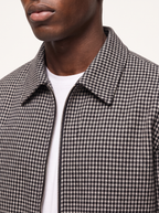 Close up of harrington collar, zip and micro plaid weave