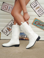 Retro pointed toe cowboy boot, styled with jeans