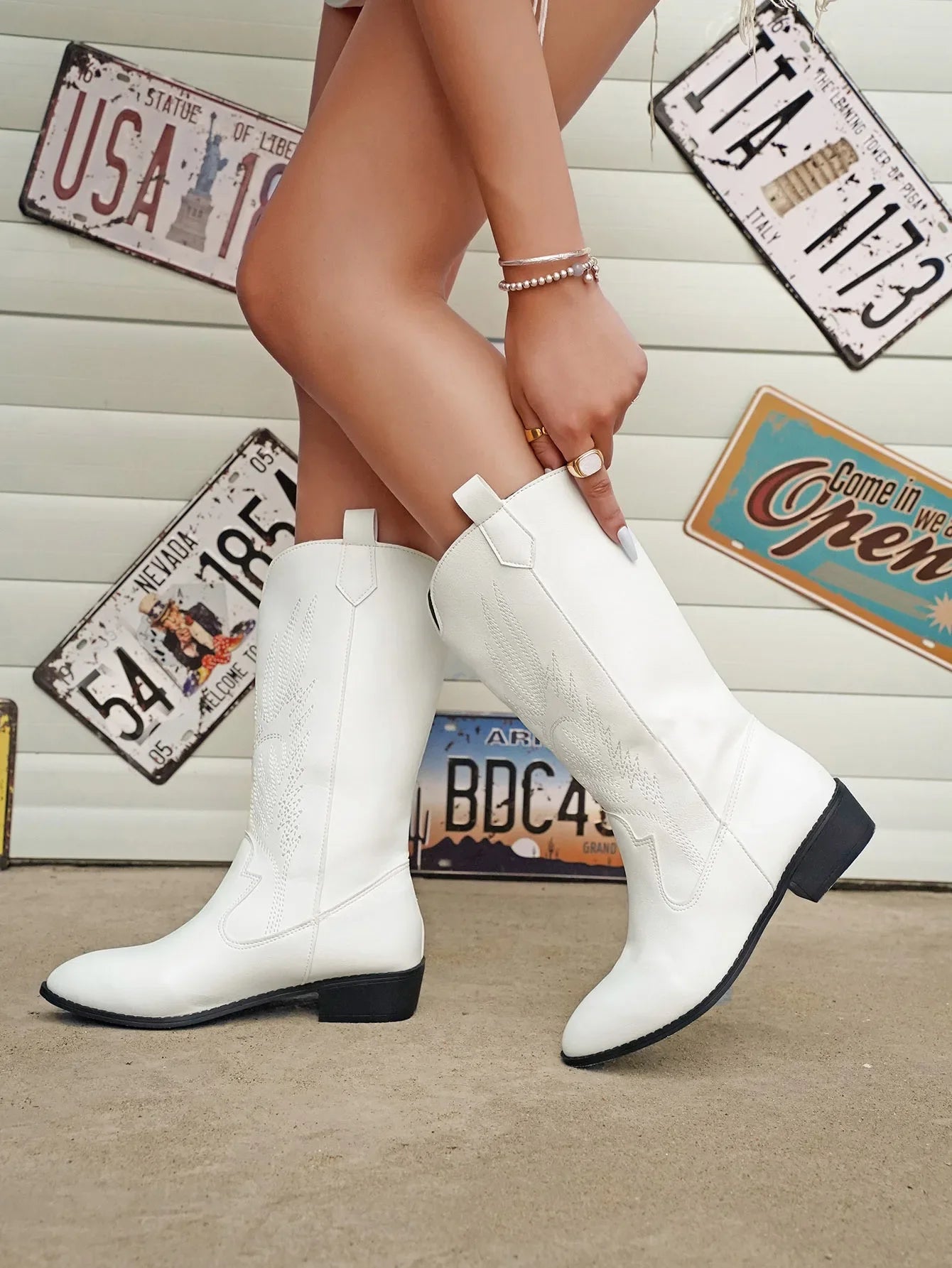 Retro pointed toe cowboy boot, styled with jeans