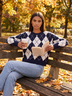 Navy argyle sweater worn outdoors, lifestyle view