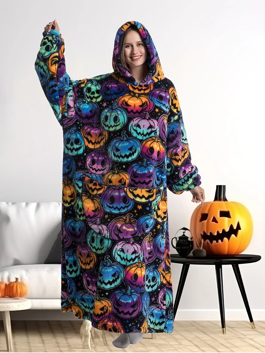 Pumpkin print blanket hoodie worn in a living room