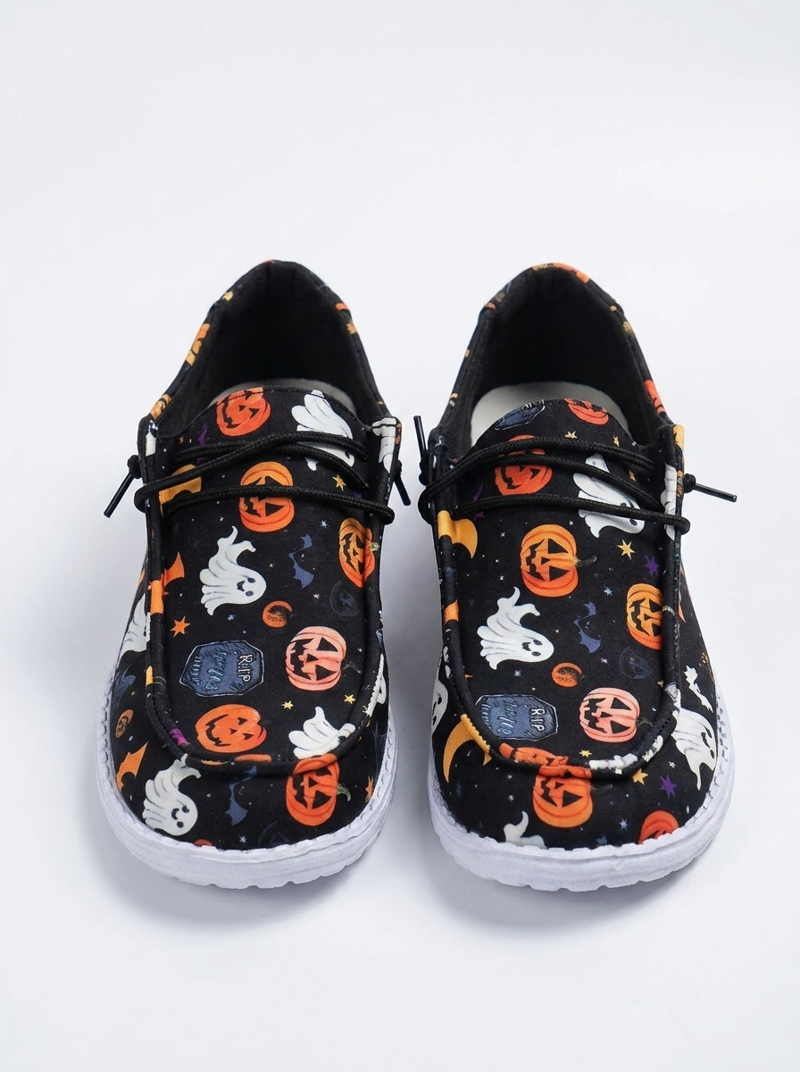 Pumpkin print slip-on loafers on a white background