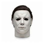 Scary latex full-head horror mask on a white background
