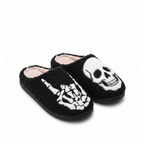 Skeleton skull plush slippers on a white background