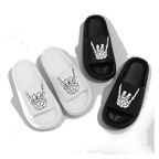 Skull hand print slide sandals on a white background