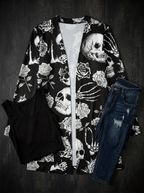 Skull print open front cardigan styled flat lay