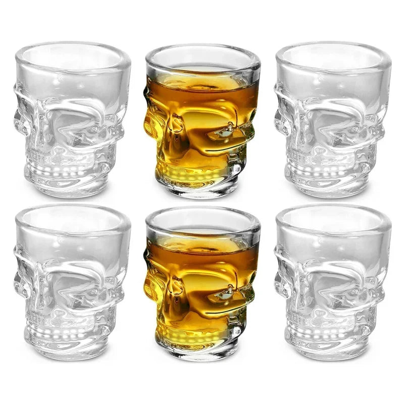 Clear skull shot glasses arranged in a group