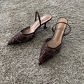 Pointed toe slingback pump, side view