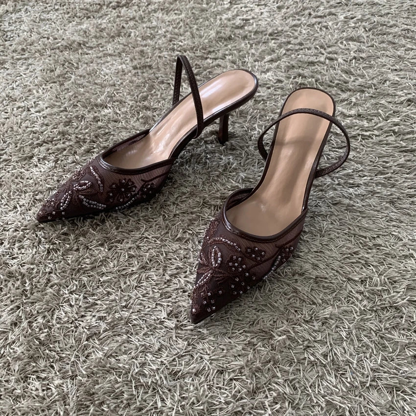 Pointed toe slingback pump, side view