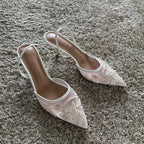 Pointed toe slingback pump, worn on foot