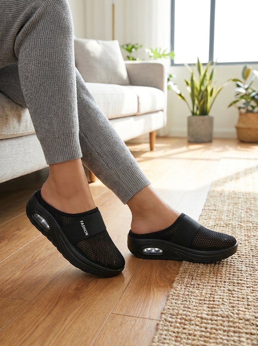Slip-on house slippers with cushioned insole worn at home