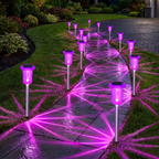 Row of purple solar LED stake lights lining a driveway and garden edge