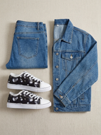 Flat lay of the sneakers with a casual outfit