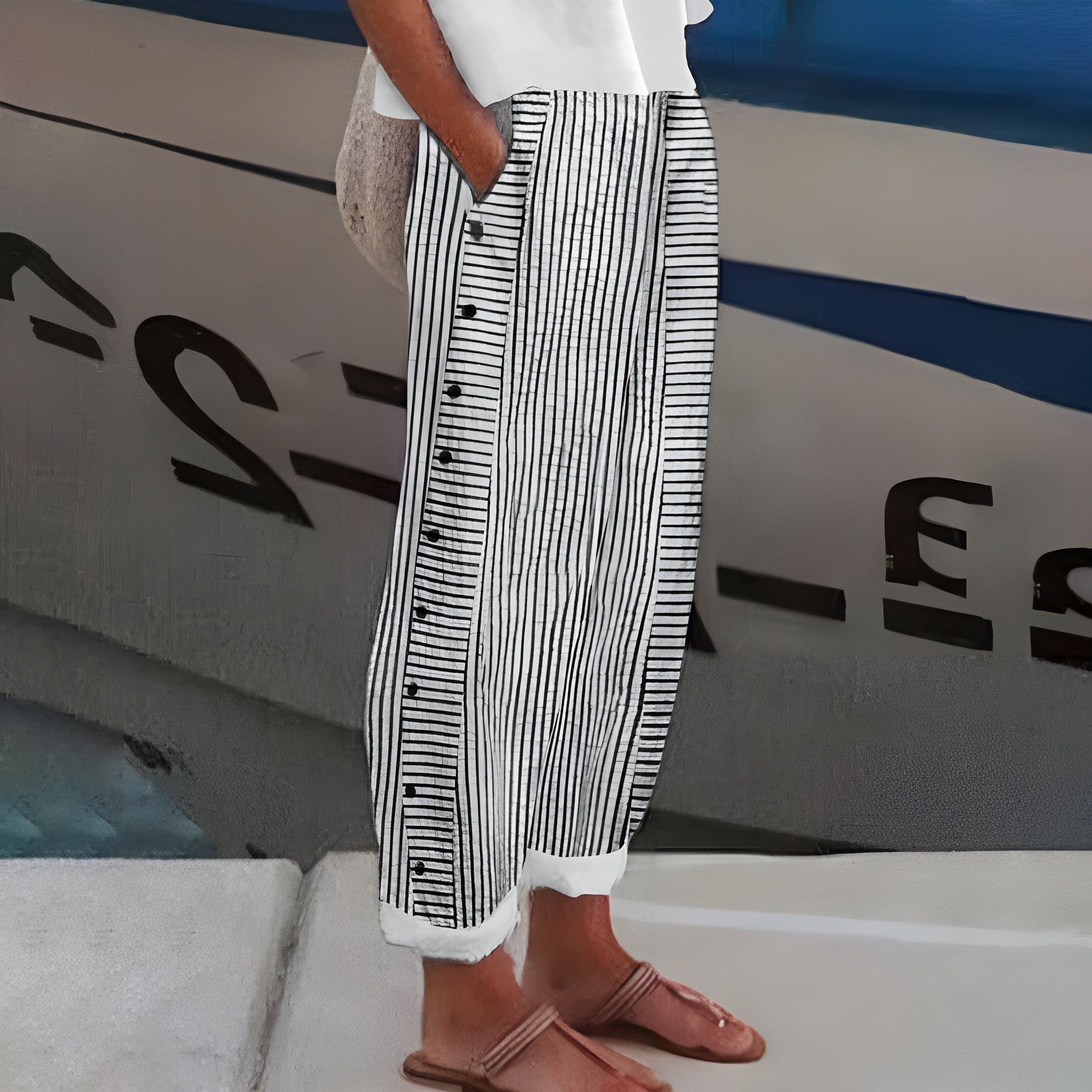 Striped tapered ankle pants in black