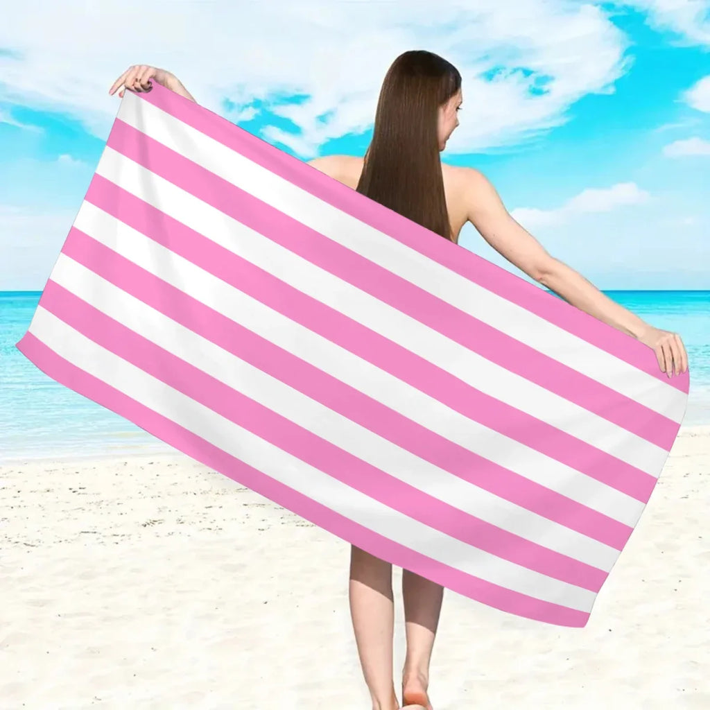 Beach towel shown on sand