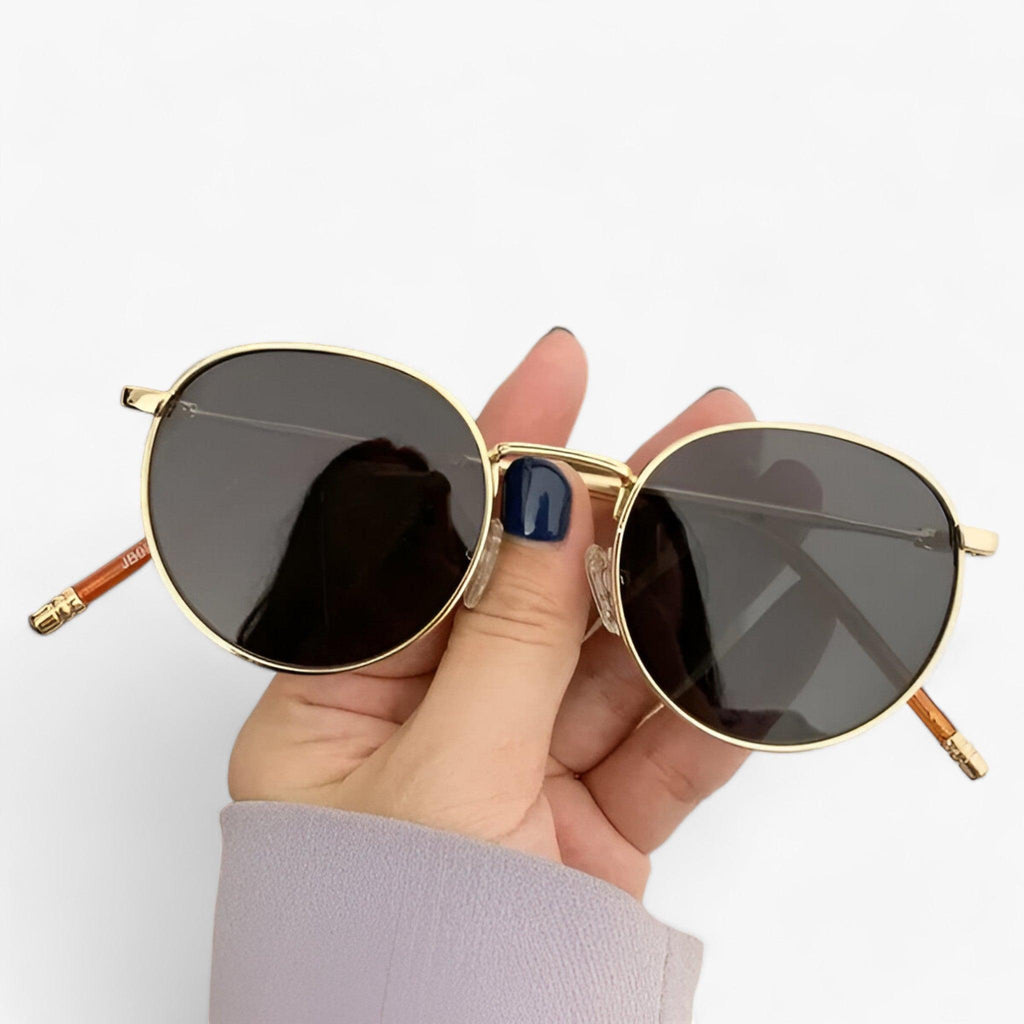 Round lens sunglasses detail view of frame and temple arm