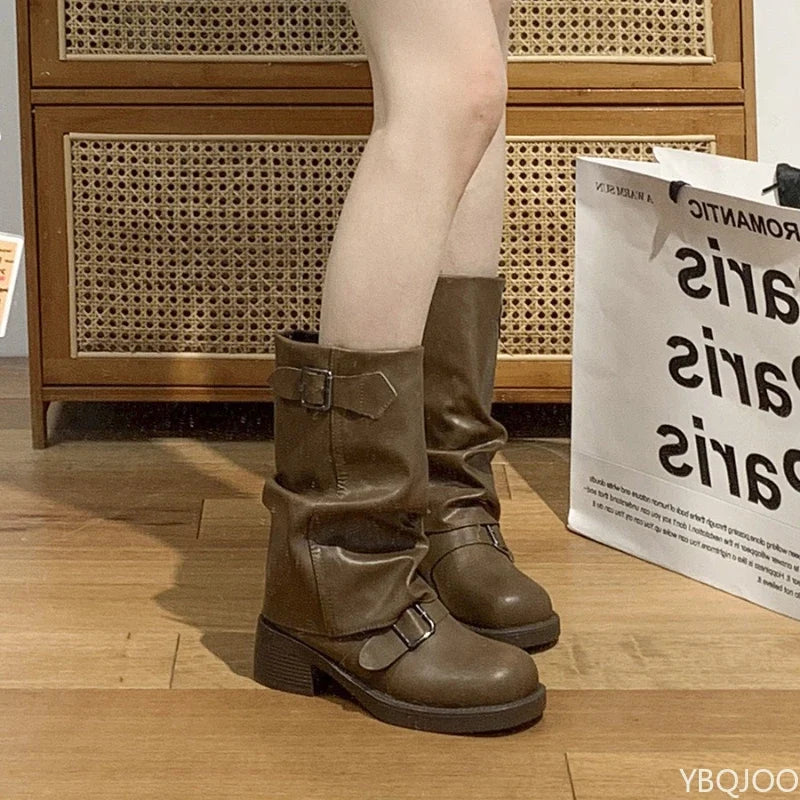 Retro brown western cowboy boot, worn on foot