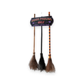 Witch broom parking sign with 3 wooden brooms on a white background