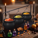 Three cauldron serving bowls on a rack styled as a Halloween table centerpiece