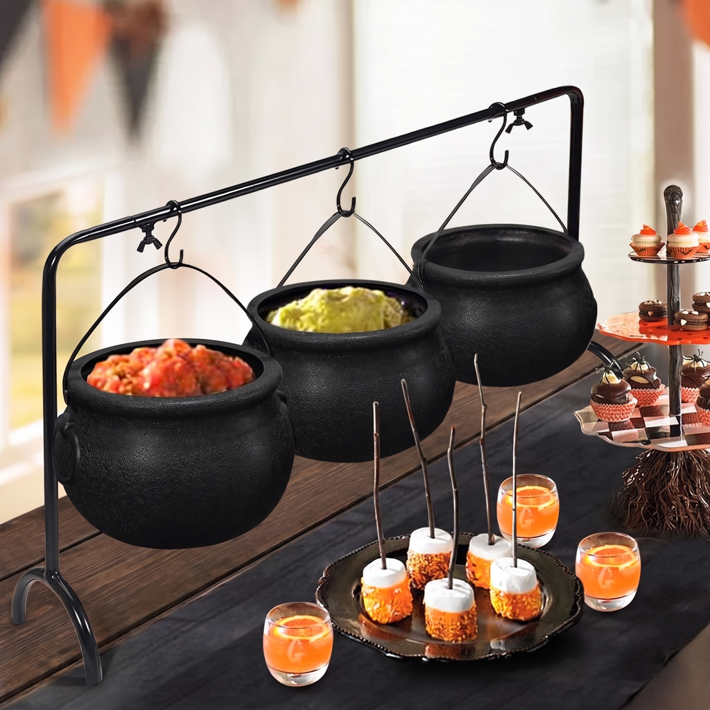 Cauldron serving bowl set holding dips and snacks at a Halloween party