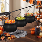 Close up of a cauldron serving bowl with handle detail on the display rack