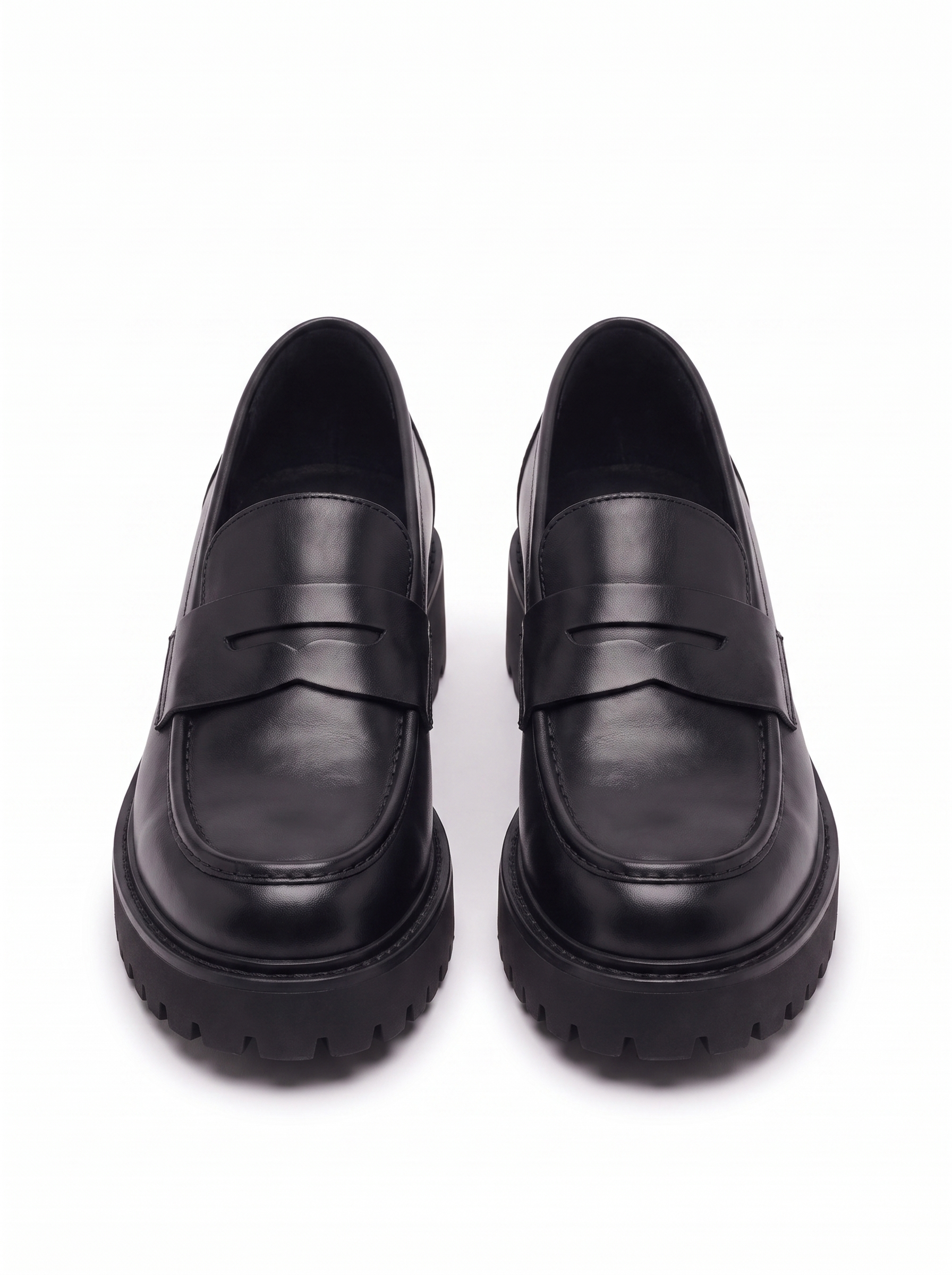 Black platform loafers product shot on white background